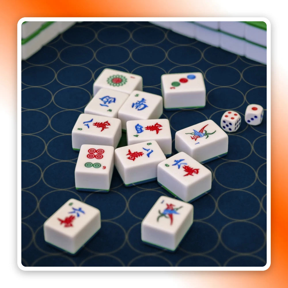 Mahjong tiles and dice on a navy and gold custom Mahjong mat