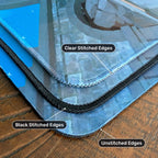 Playmat edge options compared on a wooden table: clear stitched, black stitched and unstitched edges