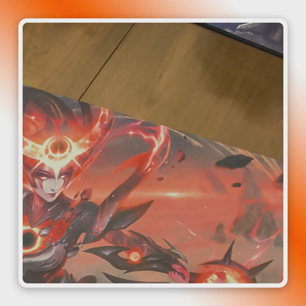 Video of a double-sided playmat flipping from an orange character artwork side to a blue artwork side, with captions highlighting double-sided printing, vibrant color and 3 mm thickness